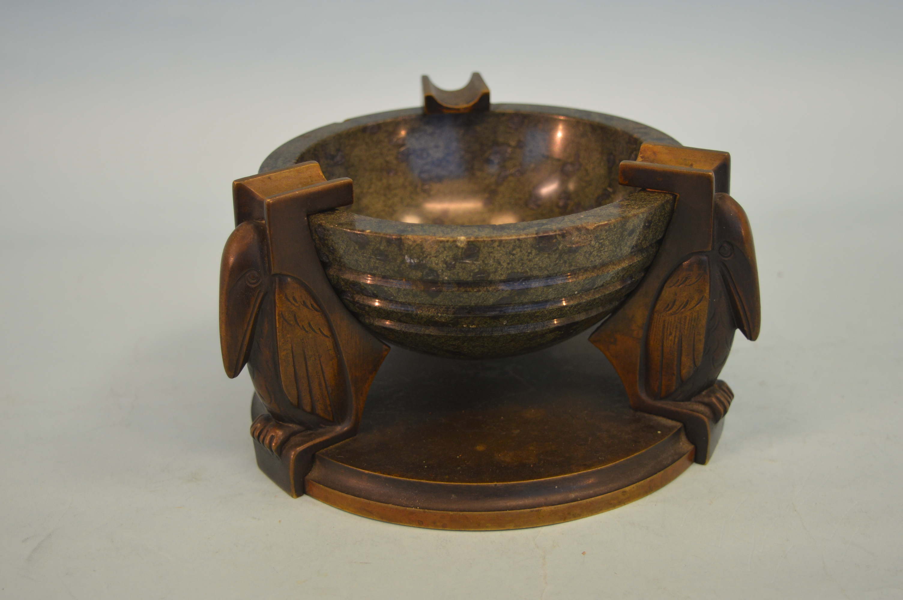 An unusual brass and agate ashtray mounted with three stylish birds on circular base. Est. £500 - £