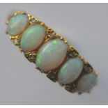 A heavy 18 carat carved opal and diamond half hoop ring. Approx. 6.4 grams. Est. £300 - £350.