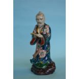 A continental pottery figure of a chinaman. Est. £