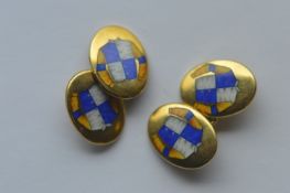 A pair of heavy 9 carat, enamel decorated, jockey cufflinks retailed by Hancocks. Approx. 14