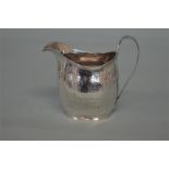 A good Georgian bright cut cream jug with reeded h