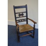 An Antique child's rocking chair with caned seats