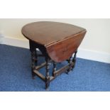 A small polished Oak reproduction gate-leg table o