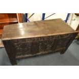 An Antique carved panel coffer with hinged lid. Es