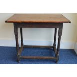 An Eighteenth Century oak side table supported on