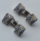 A good pair of French cufflinks mounted with diamonds and stylish cabochon sapphires. Est. £