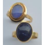 Two gold mounted blue stone rings. Approx. 7 grams. Est. £50 - £60.