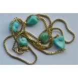 A 9 carat mounted necklace with turquoise interlinks. Approx. 9.5 grams. Est. £60 - £80.