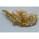 An 18 carat Georg Jensen brooch of unusual filigree design, marked 18 carat and numbered 765/53.
