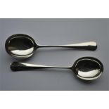 A heavy pair of rat tail soup spoons. Sheffield by