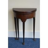 A small bowfront tilt top hall table. Est. £40 - £