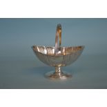 A Victorian pedestal basket with reeded sides and