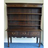 An Antique Oak dresser base with three fitted draw