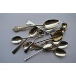 A collection of various cruet spoons, coffee spoon