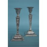 A pair of neoclassical style candlesticks with tap