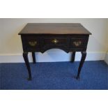 An Antique Oak carved three drawer side table with