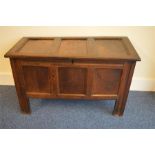 A good Oak hinged top coffer with panelled sides.