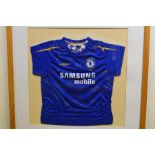 A framed and signed Chelsea Football Club shirt. E