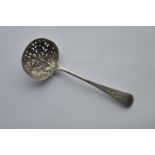 An attractive sifter spoon with floral decorated b