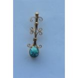 A stylish turquoise brooch with ball decoration. Approx. 2.3 grams. Est. £30 - £40