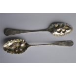 An unusual pair of dessert spoons with leafed embo