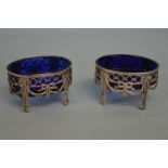 A pair of Continental silver salts, the body decor