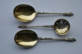 A pair of good quality, silver gilt, apostle top s