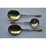 A pair of good quality, silver gilt, apostle top s