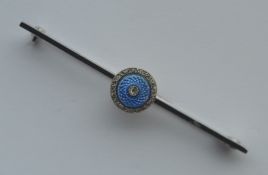 A small 14 carat bar brooch set with rose diamond and enamel centre. Approx. 3.4 grams. Est. £