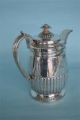 George III lidded beer jug of half fluted design,