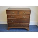 A good Oak chest of five drawers on bracket feet a