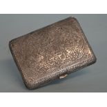 An Eastern engraved cigarette case, decorated with