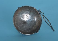 An unusual Russian tea strainer with hinged top. E