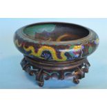 A large oval decorative Cloisonne bowl decorated w