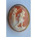 An oval cameo of a religious scene in 9 carat frame. Est. £30 - £40.