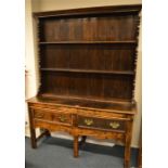 An Oak kitchen dresser with shelved back and two d