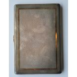 A good quality engine turned cigarette case with g