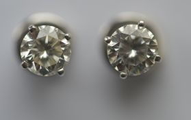 A good pair of diamond ear studs in white gold claw mount, each diamond weighing approx. 0.75