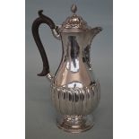 A half fluted water jug with hinged top. London 18