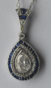 An attractive diamond marquise shaped pendant, the central stone surrounded with a row of calibre