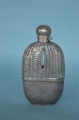 A good quality hip flask with basket weave top and