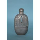 A good quality hip flask with basket weave top and