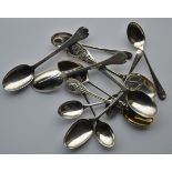 A collection of various golf collector spoons, var