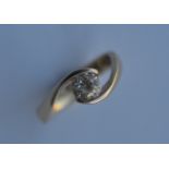 A good diamond two stone crossover ring in 18 carat band. Est. £200 - £250.