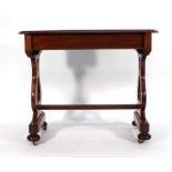 A Victorian mahogany library table with moulded serpentine top and frieze drawer on lyre-shaped