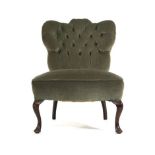 A Victorian fully upholstered armchair with buttoned back and sides on turned legs and two similar
