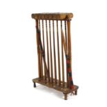 A croquet stand fitted with eight mallets, balls and other accessories, w. 82 cm  complete but