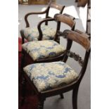 A William IV mahogany and brass inlaid carver armchair and two matching chairs together with a