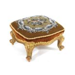 A Victorian giltwood framed footstool with beadwork top on moulded cabriole legs Bead work