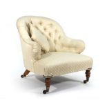 A Victorian fully upholstered fireside armchair with button backed on turned legs Re-upholstered,